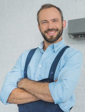 smiling-bearded-repairman-posing-with-crossed-arms-9WEV98W-1.jpg